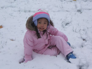 Paige Neng Qing relaxing in the newly fallen Vermont snow in winter 2008.